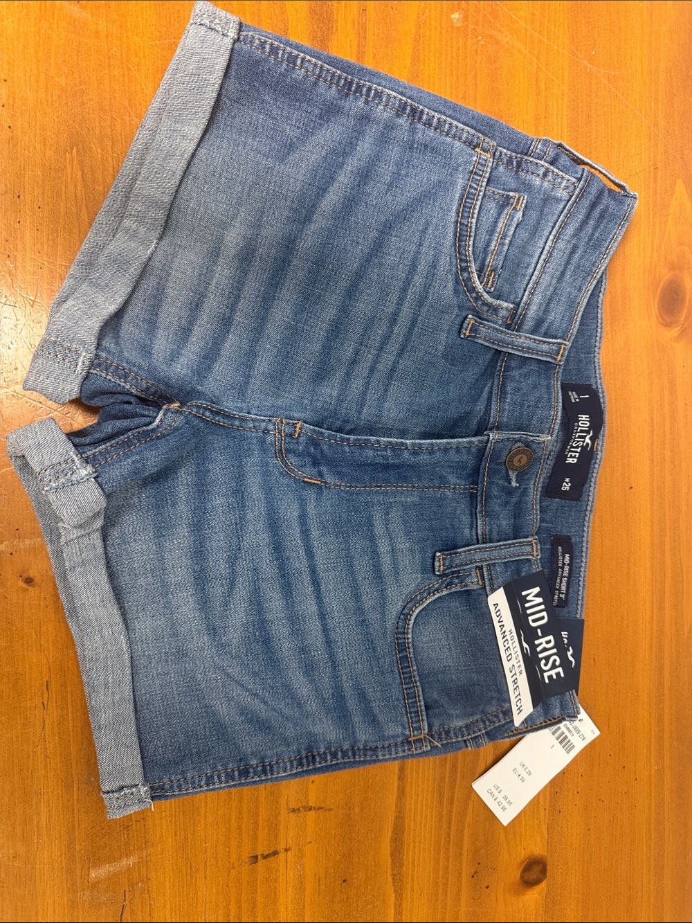 Hollister Mid-Rise Rolled Hem Denim Shorts in Light Blue Wash